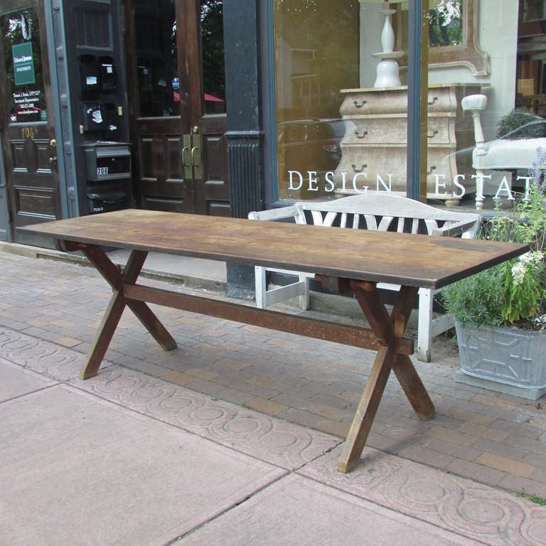 American yellow pine handcrafted eight foot long sawbuck trestle harvest table with two matching benches. All original   mortise and tenon as well as pegged construction with beautiful as found richly aged patina to the table & benches. All pegs (