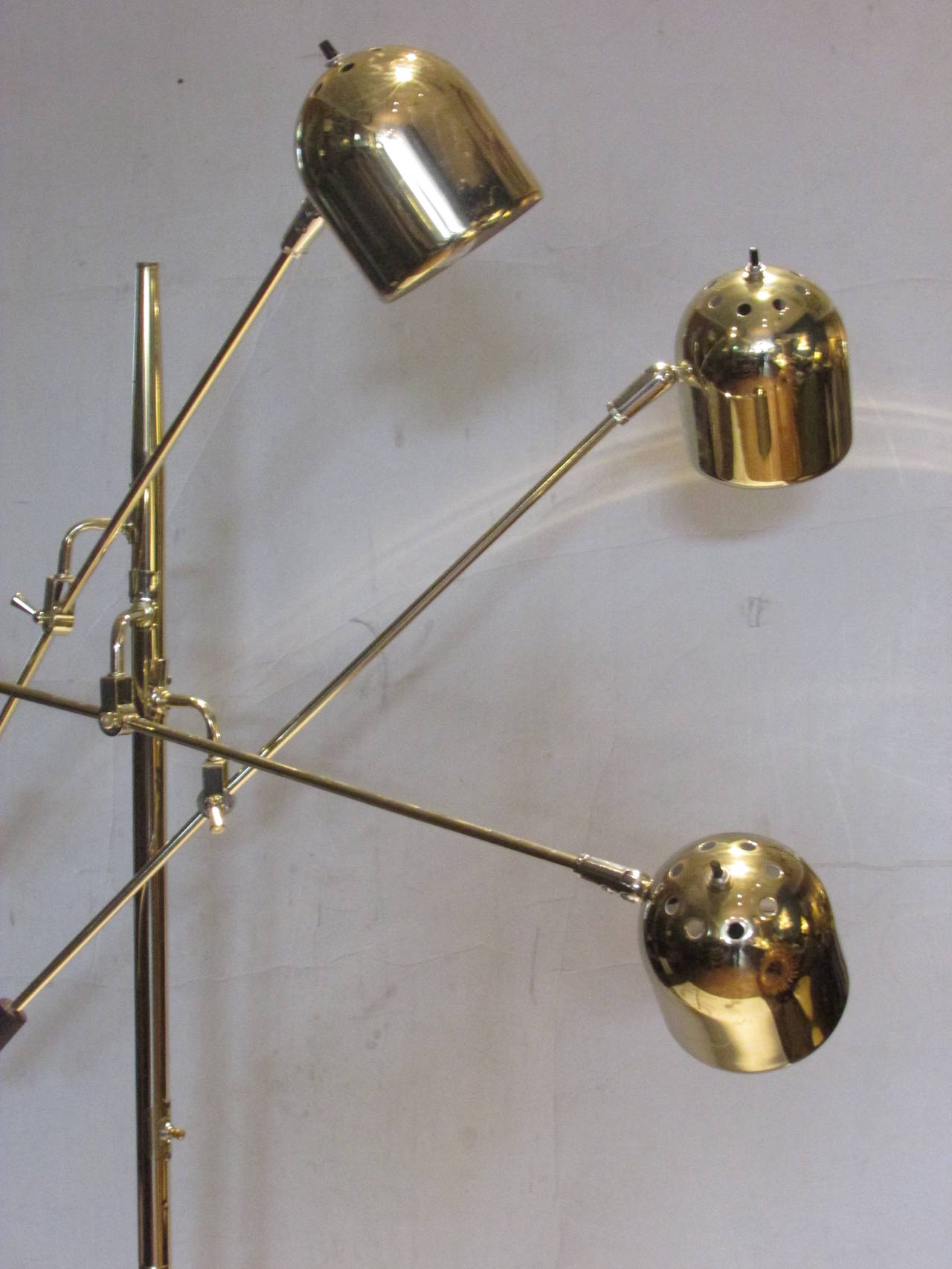 A good quality 1960s Italian modernist marble and brass floor lamp with three articulating armatures - each ending in textured cast metal handles. The pierced brass shades each having independent on / off switches as well as a single on / off switch