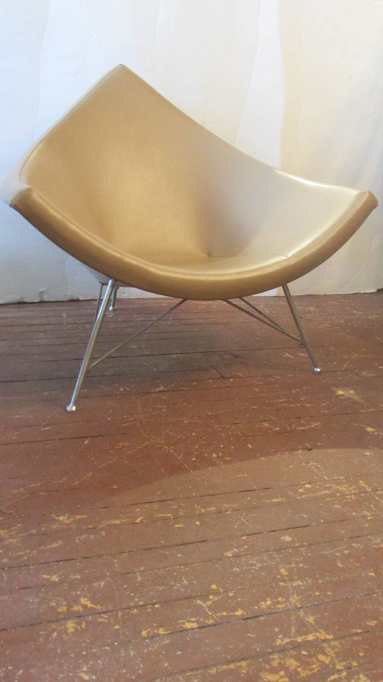 A coconut chair & ottoman by George Nelson for Herman Miller. Purchased in the 1950's by a local interior designer and in her collection till this time. An exceptional early example in original beautiful condition.