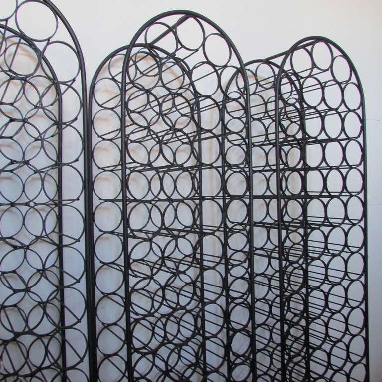 Three Mid 20th Century American Modern arched top free standing iron wine racks by Arthur Umanoff - they are all 6 feet high with each having the capacity of holding 67 bottles. Priced at $875 per rack.

 **** One wine rack has been sold - there
