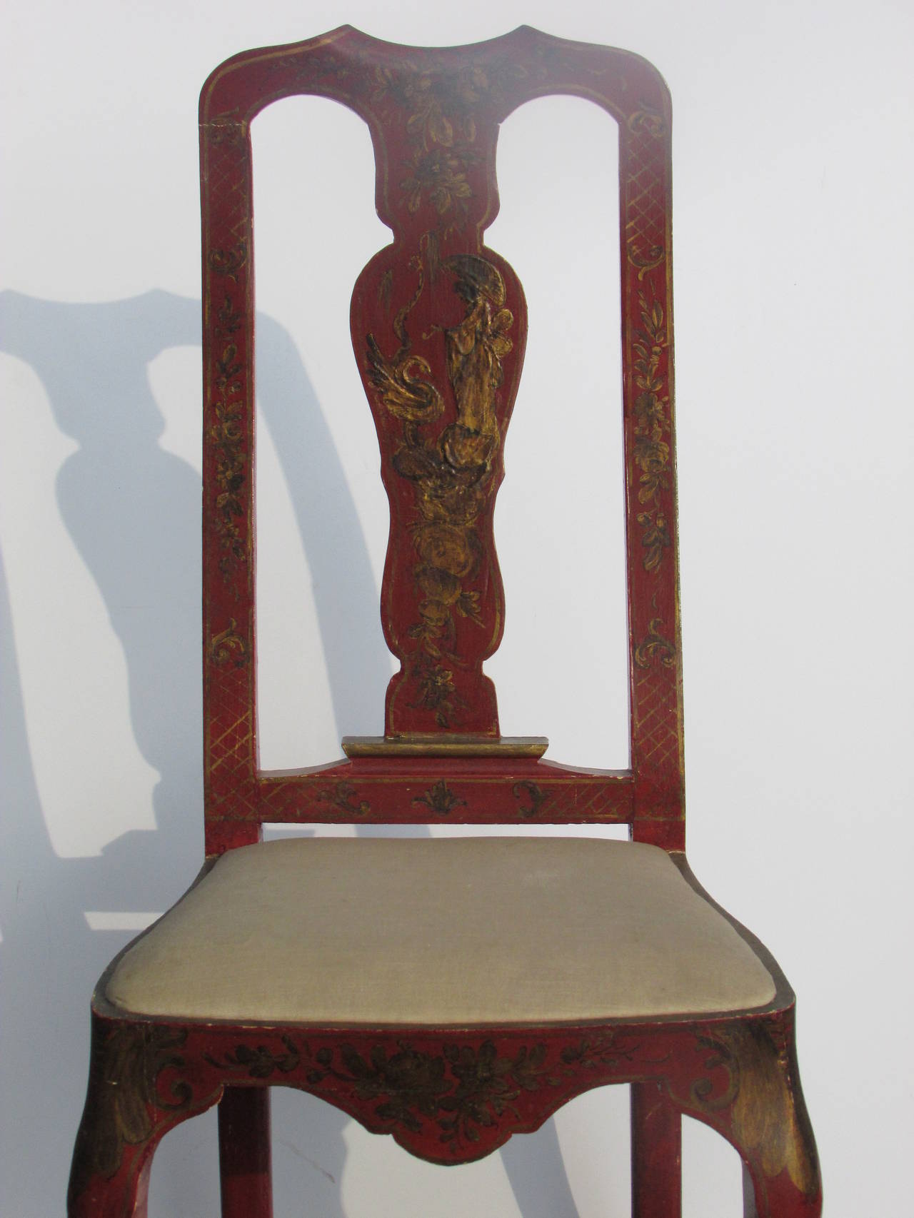 In the 18th century Venetian style a tall back chair in original rich crimson painted and finely gilded raised Chinoiserie decoration over underlying gesso. Stamped on inside of seat rail - made in Italy. circa 1940