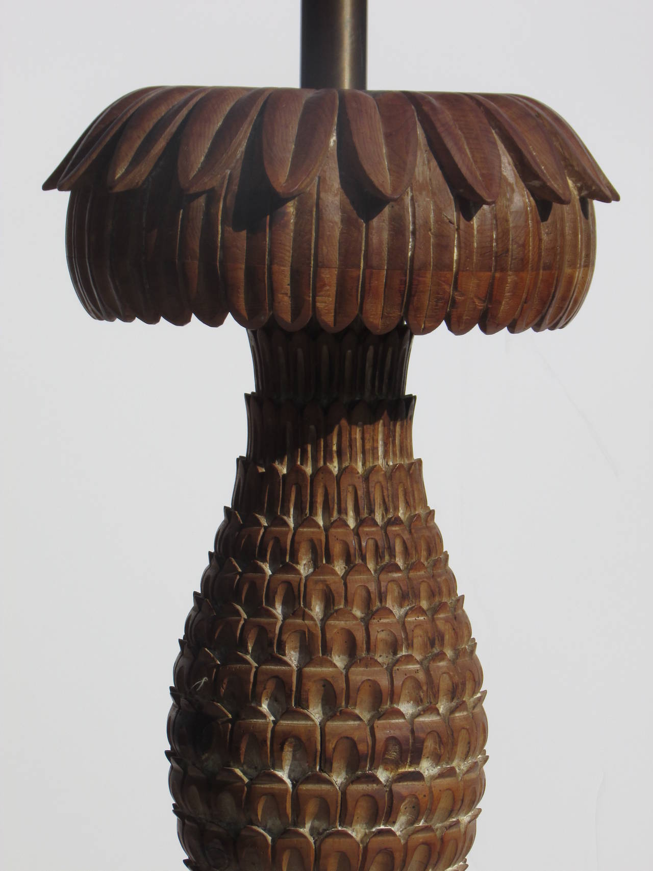 An exceptionally beautiful carved wood pineapple bromeliad table or floor lamp by Marbro with perfectly aged all original surface to wood. Retains the Marbro Original silver foil label at top of central brass shaft. Measures 57 inches to top of milk