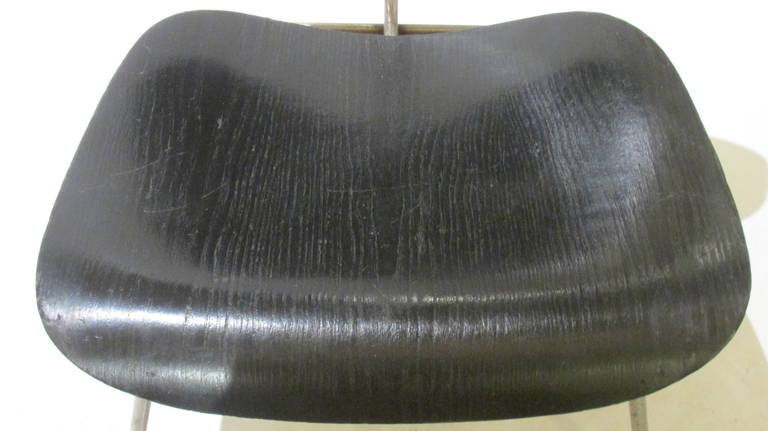 Early vintage LCM by Charles & Ray Eames for Herman Miller in black aniline finish.