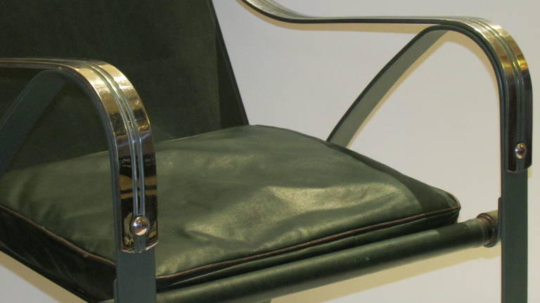 Machine age Sling chair designed by Salvatore Bevelacqa for Mckay Craft, 1930's.  All original chrome plated steel frame with green painted factory finish / green oil cloth upholstery sling w/ attached head rest pillow, seat cushion. Shown in