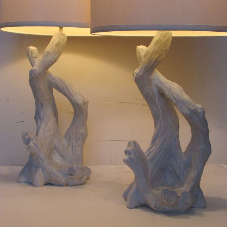 A pair of mid 20th century plaster faux bois style tree trunk lamps in dry white and pale gray painted surface. The tree height is 17 inches.