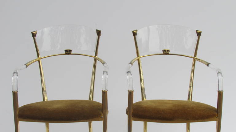 An exceptionally beautiful and what we believe to be a very rare pair of ultra sleek Regency style. Lucite and decorated gilded metal armchairs. Most likely Italian in origin, circa 1960. Have yet to see anything remotely like them.
