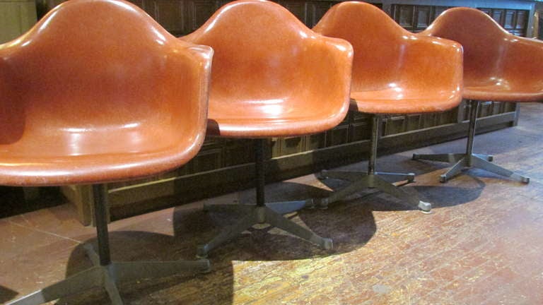 20th Century Eames Salmon Fiberglass Swivel Chairs
