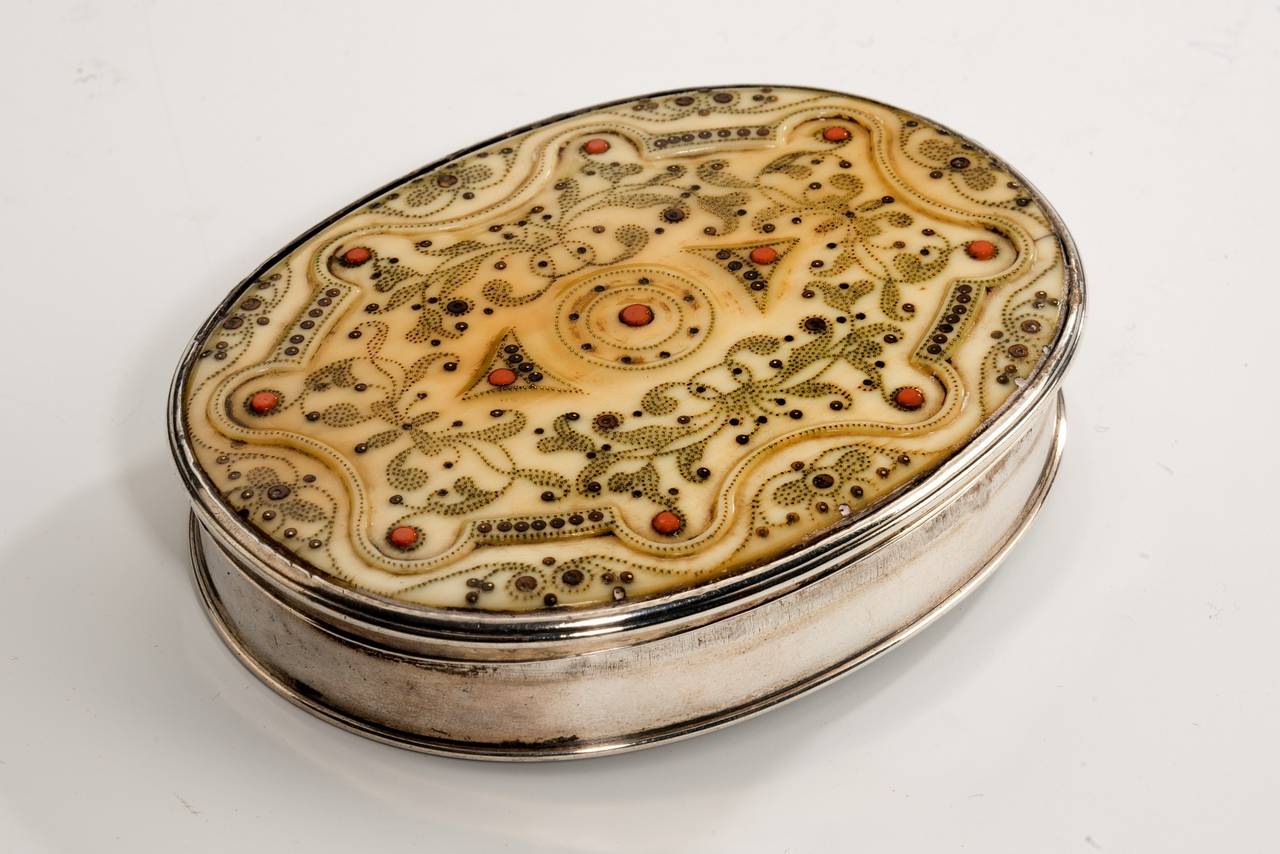 A very rare Charles II period oval silver-mounted ivory snuff box inlaid with fine gold pique decoration and coral. Receipt from Rupert Gentle Antiques; Grosvenor House Antiques Fair 2001.