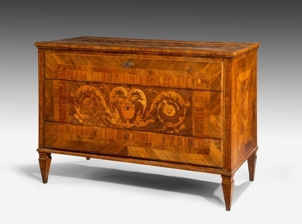A walnut and Kingwood Italian marquetry three drawer commode chest of drawers. Raised on four small square tapering feet. The whole is in the manner of Giuseppe Maggiolini, of Lombardy in Northern Italy.