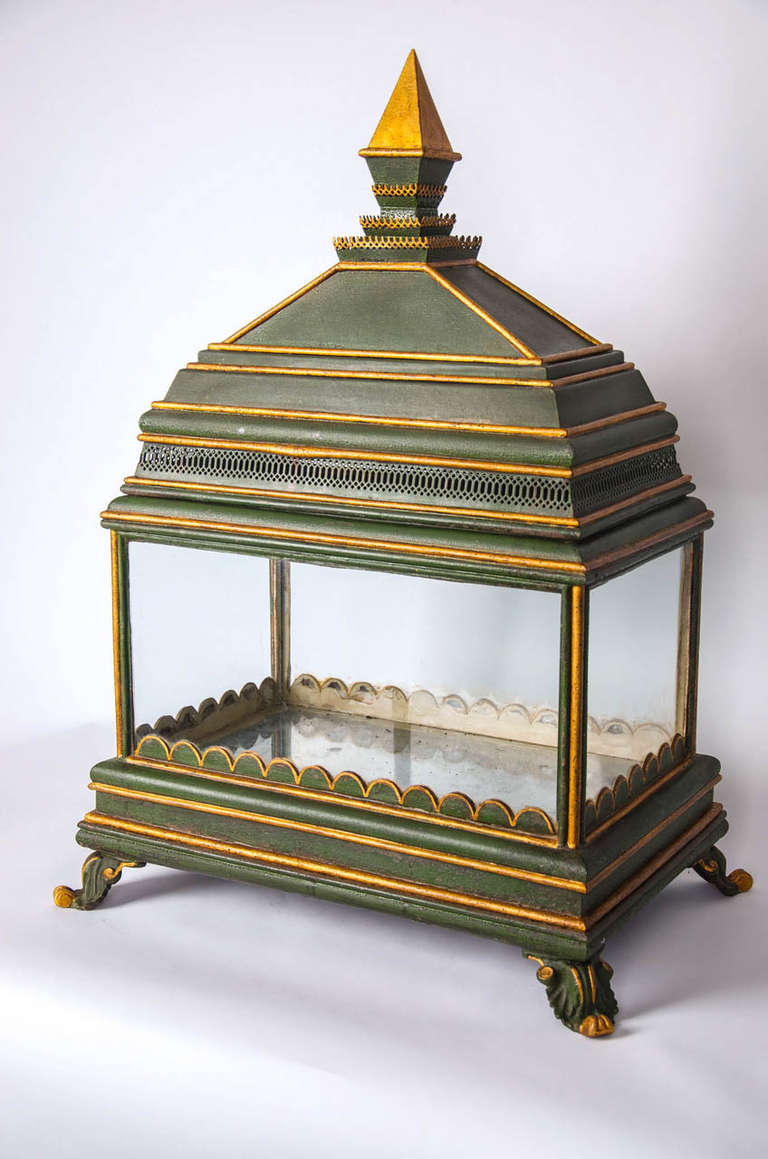 A very rare 19th century fernery or Wardian case. Retaining green and gilt decoration.
The whole is raised on four scrolled feet in stylised leaves. The upper section has a metal lid which may be removed for maintenance of the ferns. The pierced