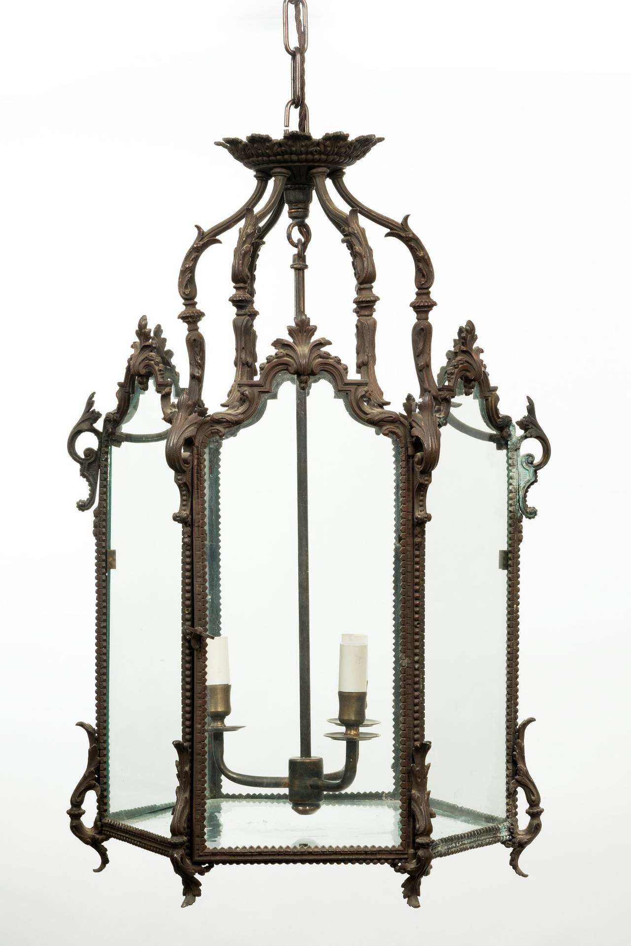 A good quality 19th century patinated bronze octagonal hall lantern, with scrolled supports and a finely cast corona; the whole has been re-wired ready to hold three light candle-bulbs