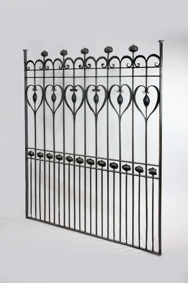 A highly stylised black painted Arts and Crafts panel with an elegant sinuous outline. Circa 1900.