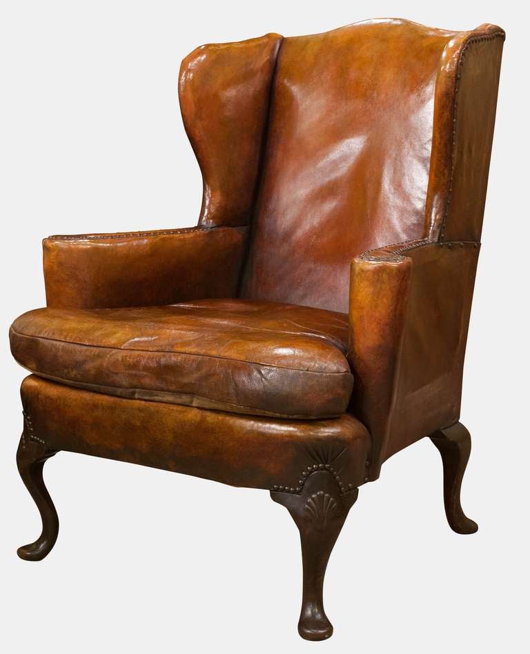 A beautiful Queen Anne style camel back wing armchair in well patinated leather of good colour

Circa 1920