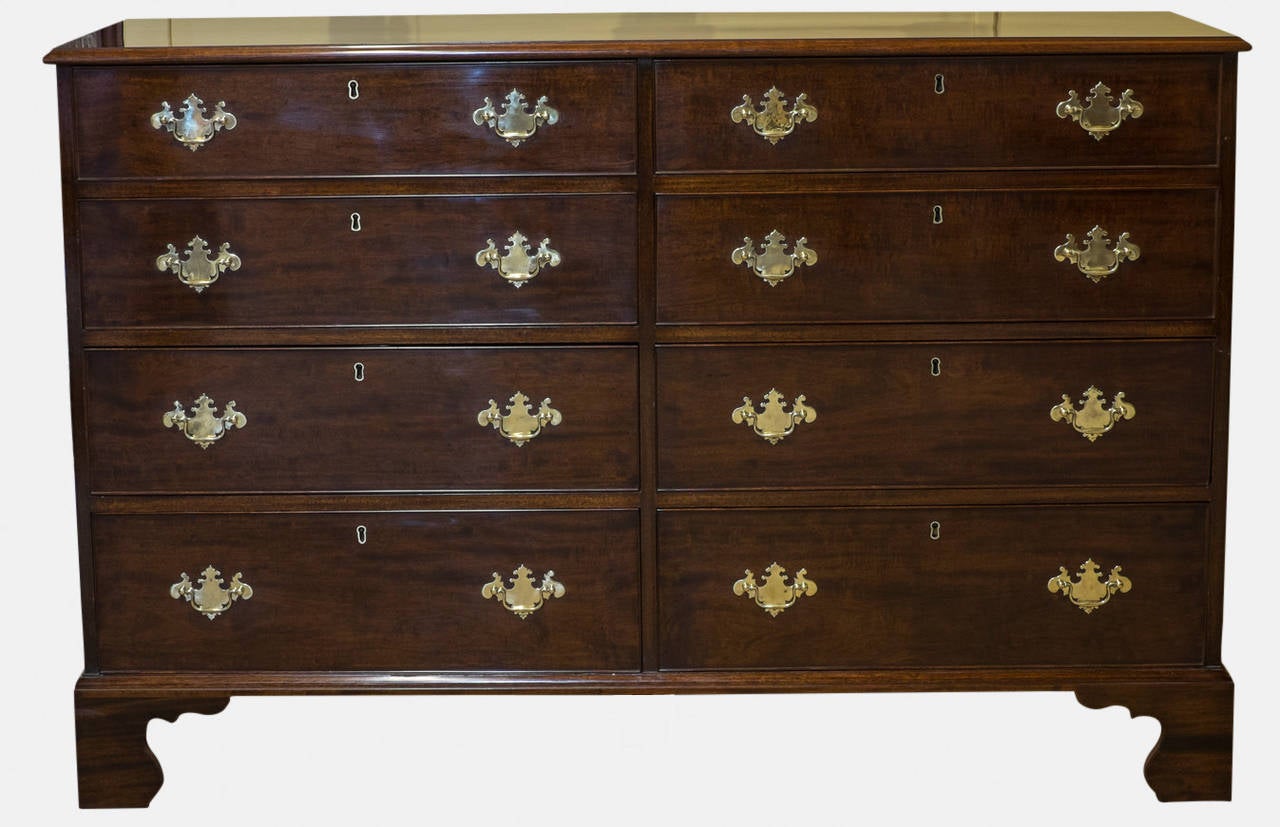 A Georgian mahogany oak lined chest of eight drawers.
Figured and banded top, original locks and replacement handles,

circa 1760.