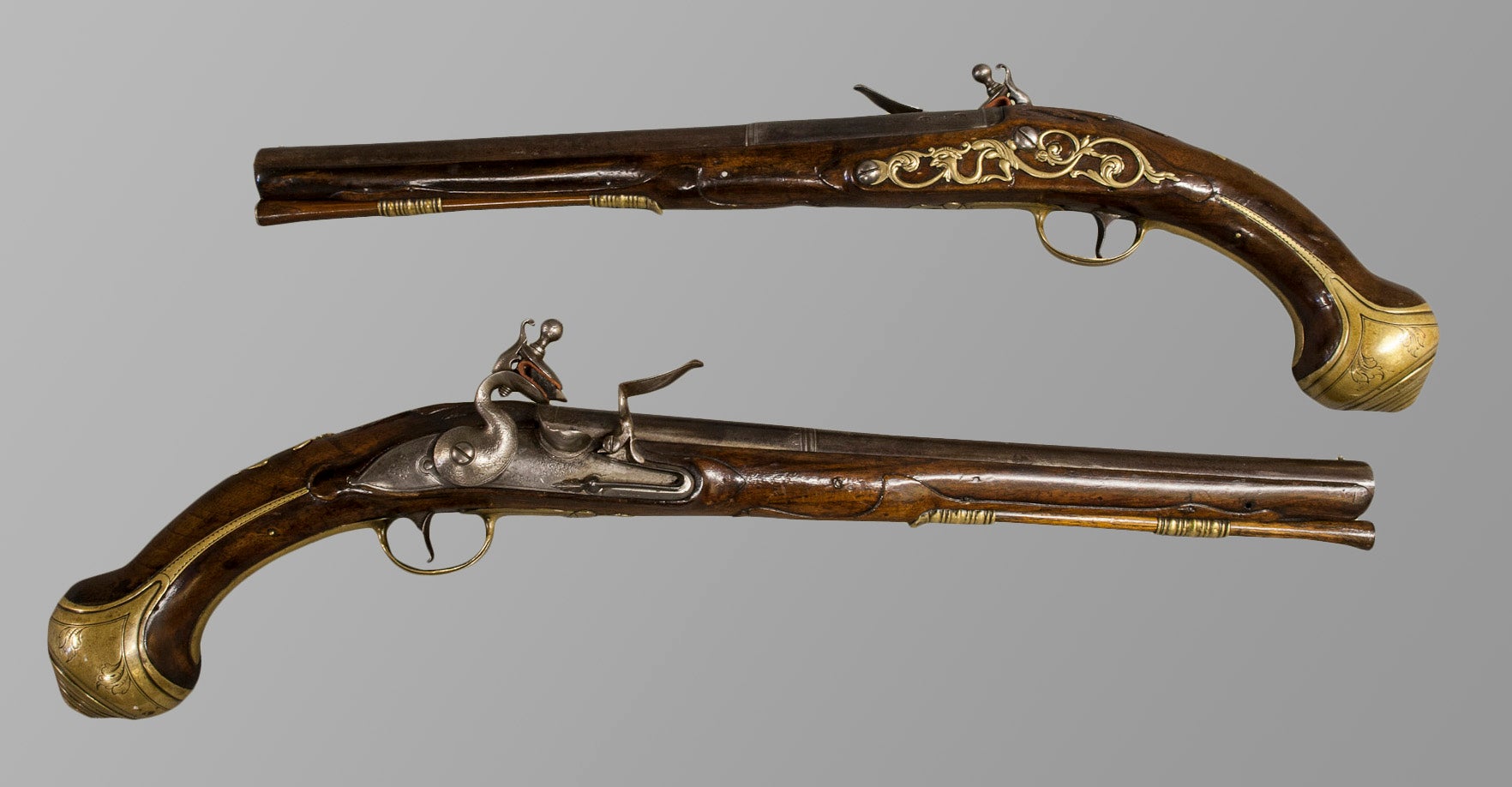 Pair Of Long Flintlock Holster Pistols With Figured Walnut Stocks For Sale