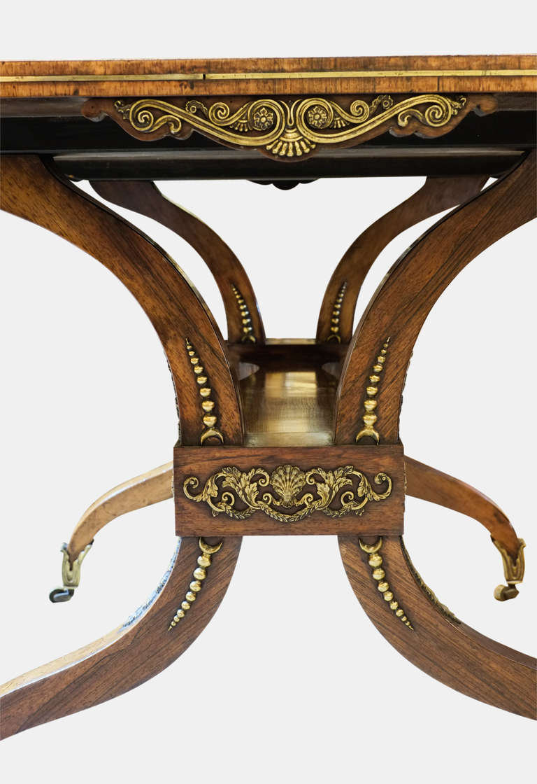 A Regency rosewood brass inlaid library table in original condition.

Circa 1820