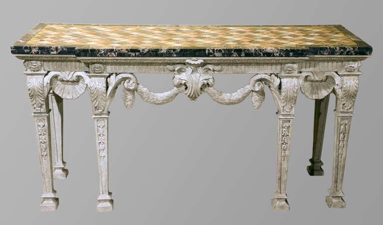 An imposing and abundantly carved 20th century painted console table of George II design with a large inlaid Specimen marble top probably of an earlier date.

If you are interested in this item, it is wise to enquire straight away. Listed items
