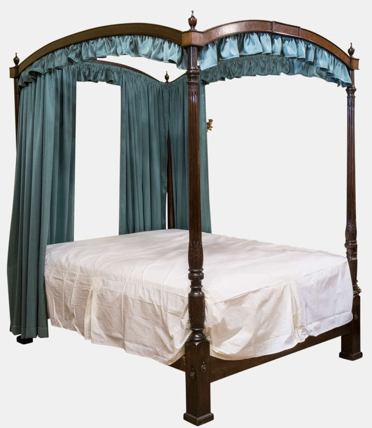 A fine late Georgian mahogany 4 poster bed.
The footposts elegantly carved in hepplewhite style with stiff leaves complete with box base and mattress.

Circa 1800-1820 (with restorations to cornicing)