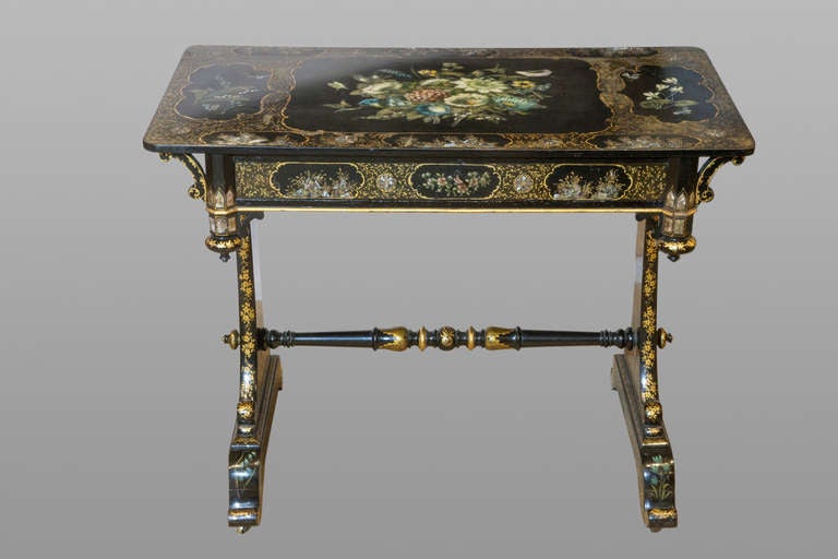 A good Regency slate topped table with original painted & Gilt decoration.