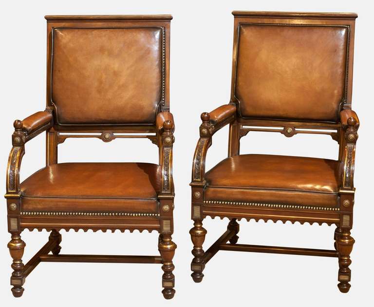 A pair of French hand dyed hide upholstered mahogany armchairs with brass mouldings.

Circa mid 19th Century