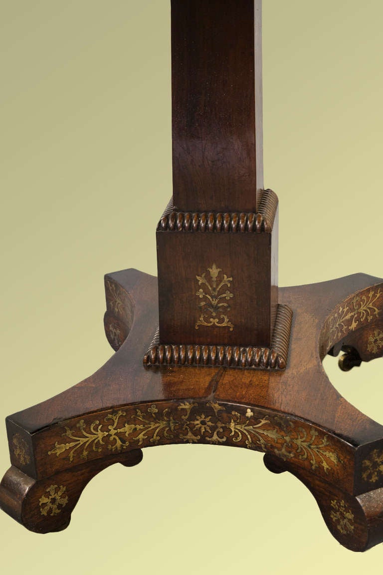 A fine Regency period brass-inlaid rosewood card table.