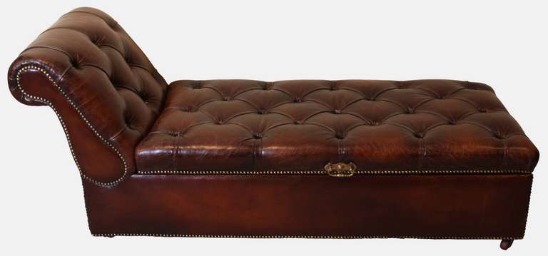 A Victorian leather ottoman/day bed with deep buttoning.
Circa 1880.