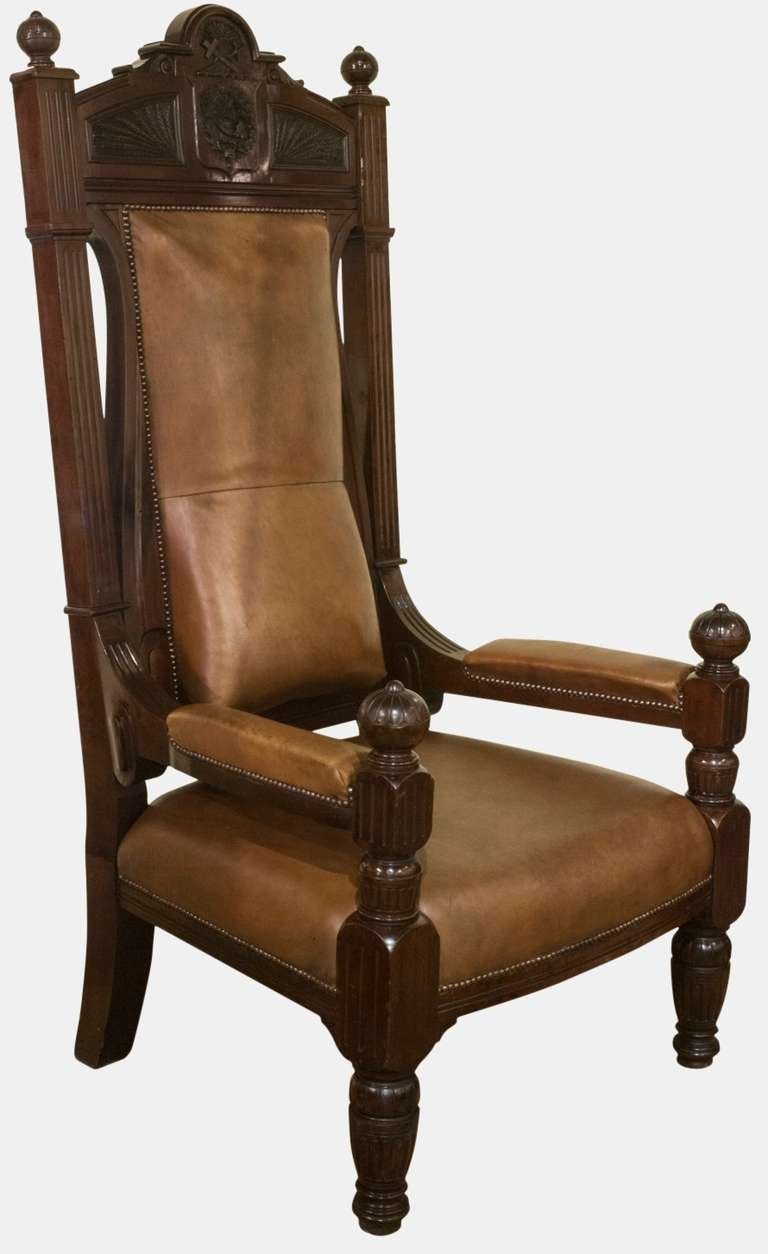 An impressive late 19th Century Masonic fiddleback mahogany and leather throne chair of large proportions