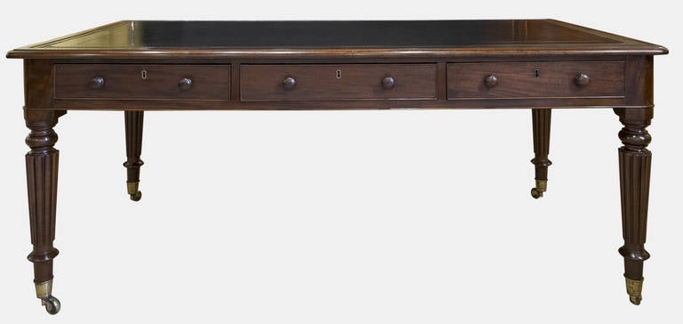 A six-drawer mahogany library table in the style of Gillows with oak lined drawers and original mahogany knob handles.
With hand dyed and tooled hide
Circa 1830