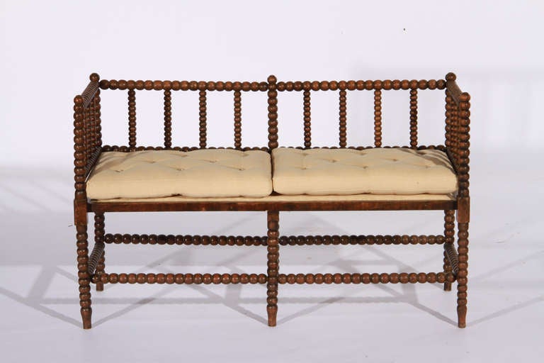 Late 19th century English bobbin turned bench with tufted lined cushions