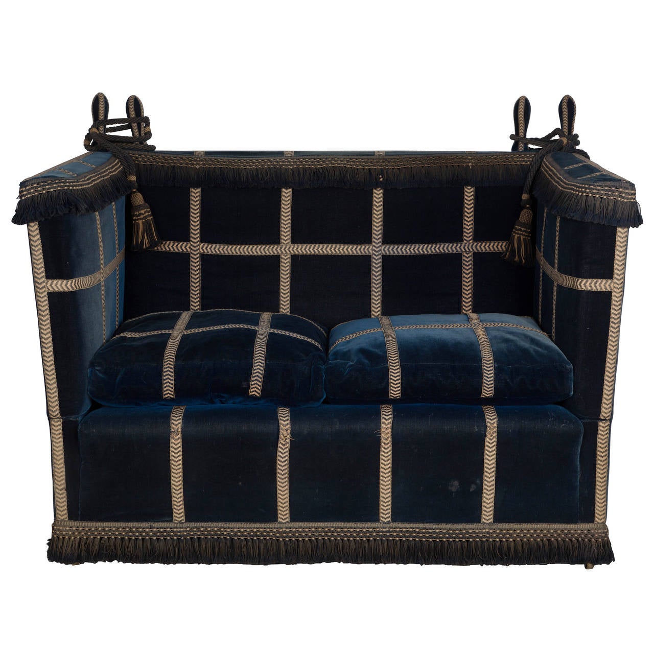 Edwardian small knole settee in original velvet upholstery and braiding. Attributed to Hamptons, by appointment suppliers of upholstery to her majesty queen Mary, Buckingham Palace.