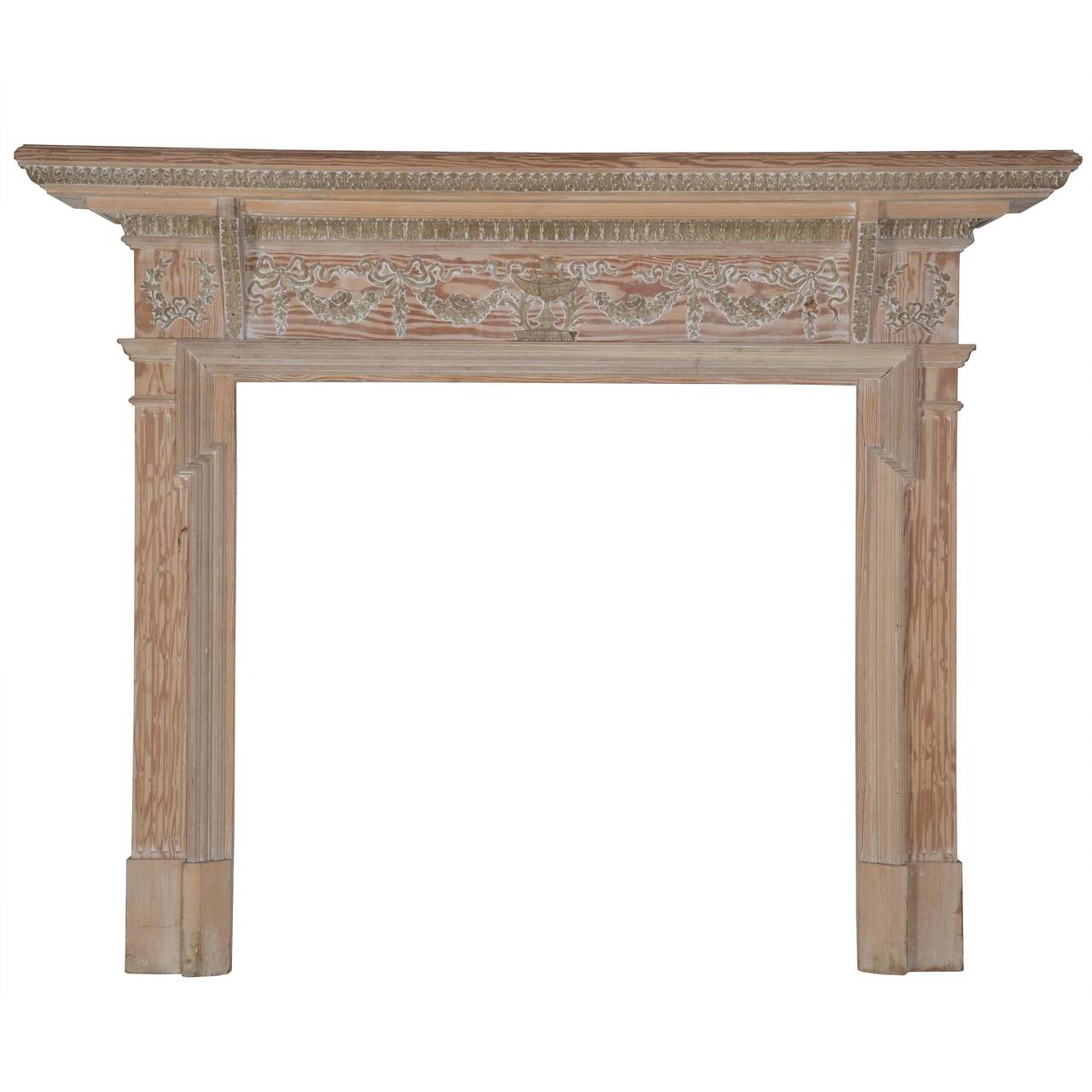 A pair of late 19th century English pine and gesso fire surrounds in Georgian style.