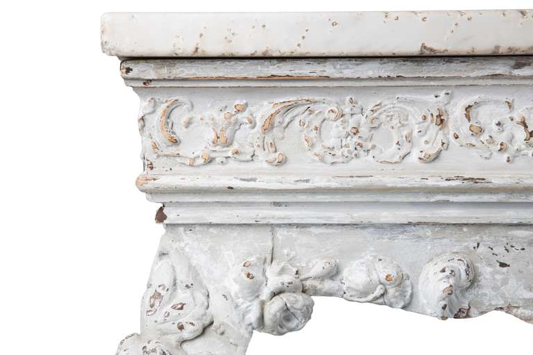 A 19th Century carved wood and gesso console table with original marble top.