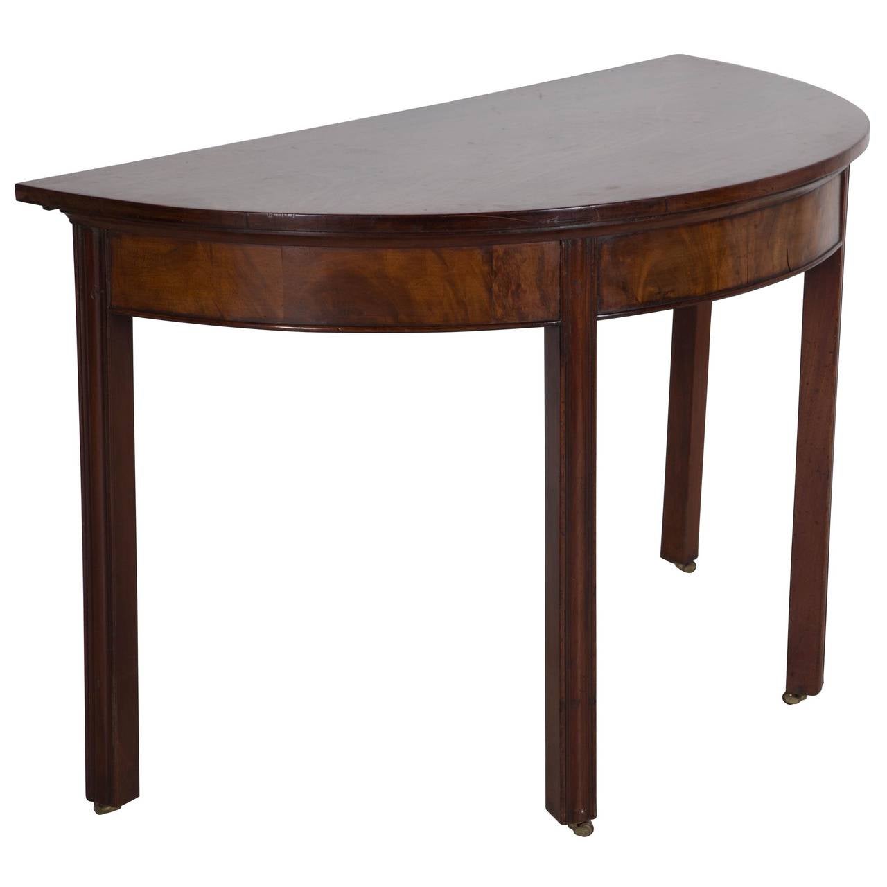 George III mahogany dining table comprising a pair of D ends and a drop-flap centre table.