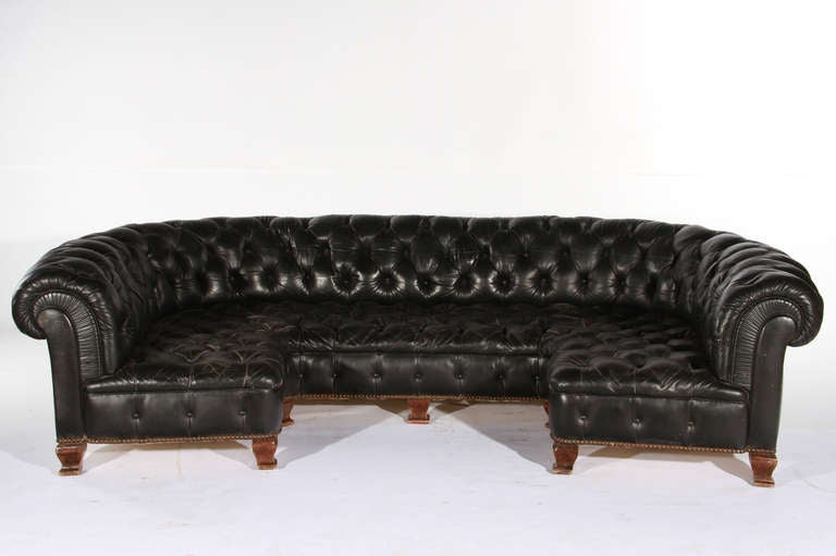 Early 20th century u-form black leather sofa.
