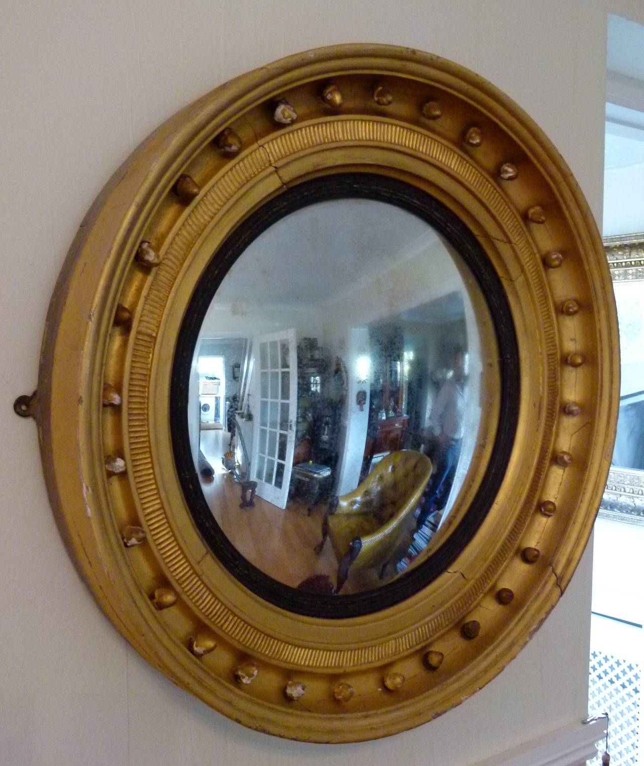 Mirror glass is 44cm across.

Round vintage convex mirror, with Black and Gold wooden frame.

Gorgeous patina to both the paintwork on the wooden frame and the mirror glass.

A sizeable, attractive, original Georgian piece.