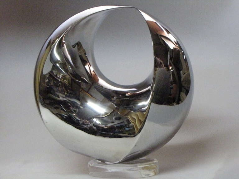This stunning contemporary sculpture is the culmination of twenty years of work by Samvado in developing this form. A truly beautiful piece, exquisitely executed. 

This example in highly polished Stainless Steel has a diameter of 300mm.

Other
