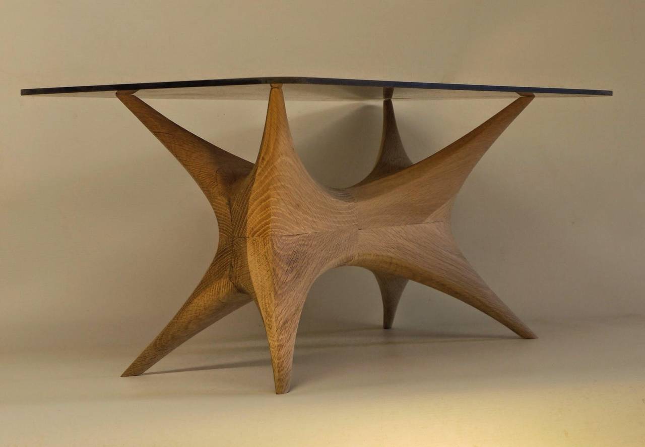 Invariance Coffee Table by the British Designer Kinsley Byrne c.2015

Another superb offering from this British designer, translating as the 'Unchanging' table, this piece marries a sculptural wooden structure with a floating glass top.

Various