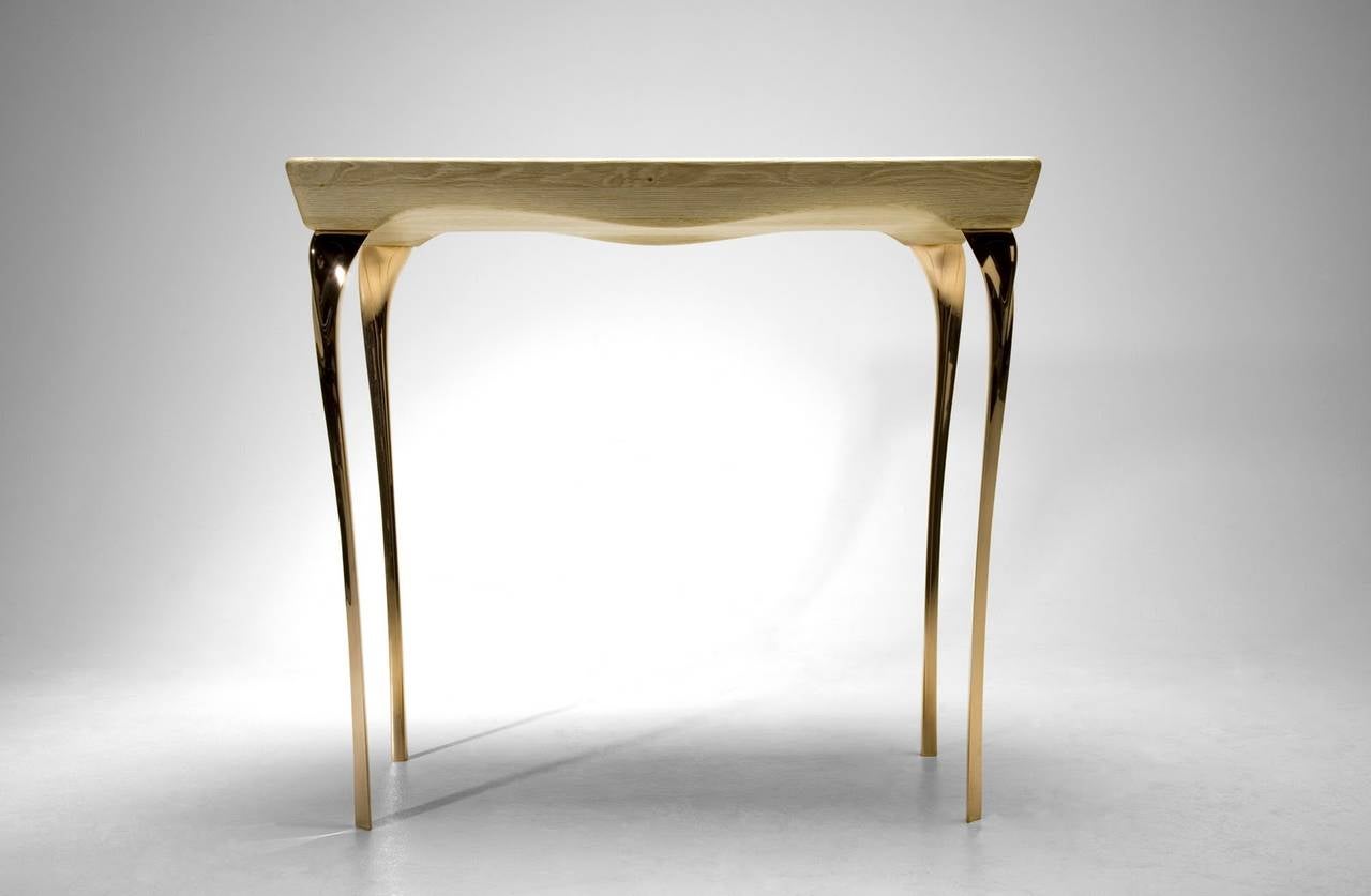 Contemporary bronze and oak console table by Kinsley Byrne, circa 2013.

A stunning piece by this British designer.

custom-made, allowing for bespoke options and sizing.

Kinsley's craftsmanship and eye for form and detail is second to none,