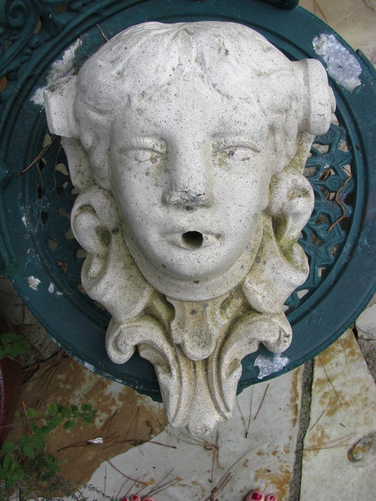 Lovely old fountain wall spitter , old concrete