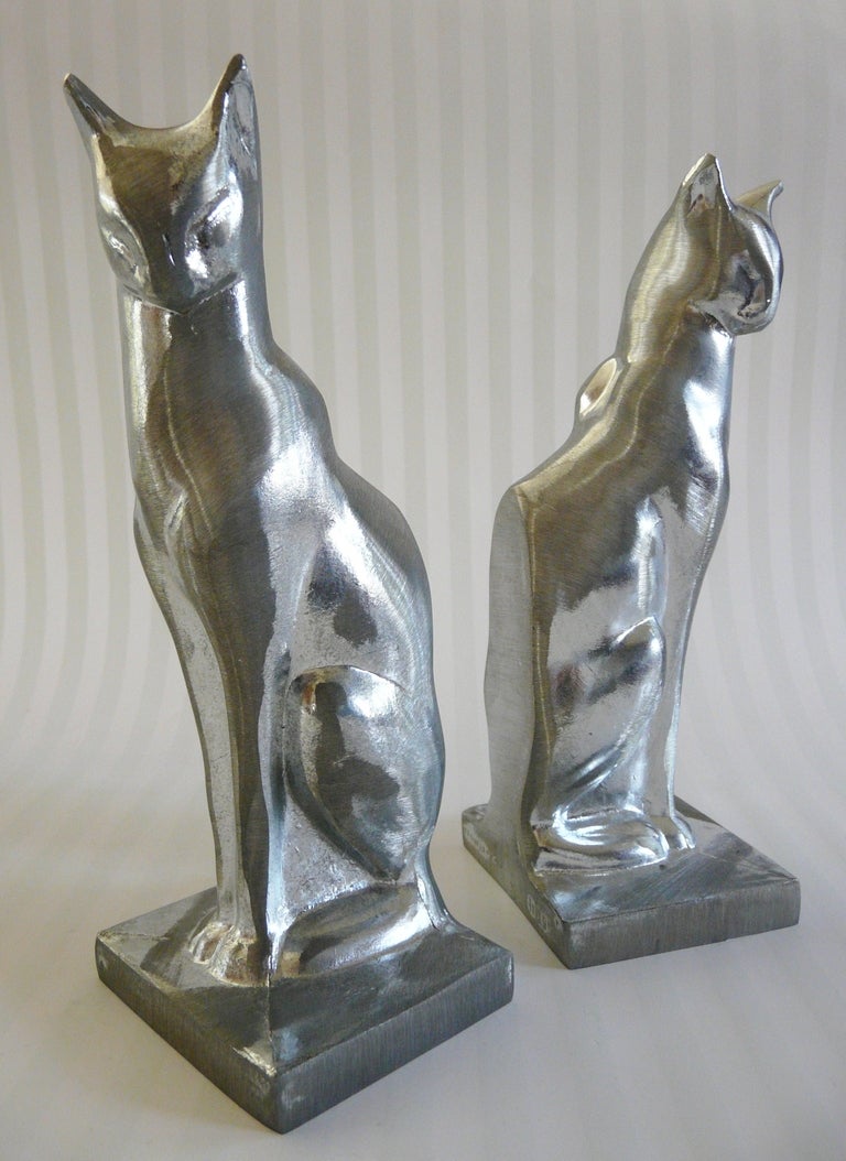 Stylized pair of polished aluminum Frankart bookends in cat form having sleek Art Deco style.  