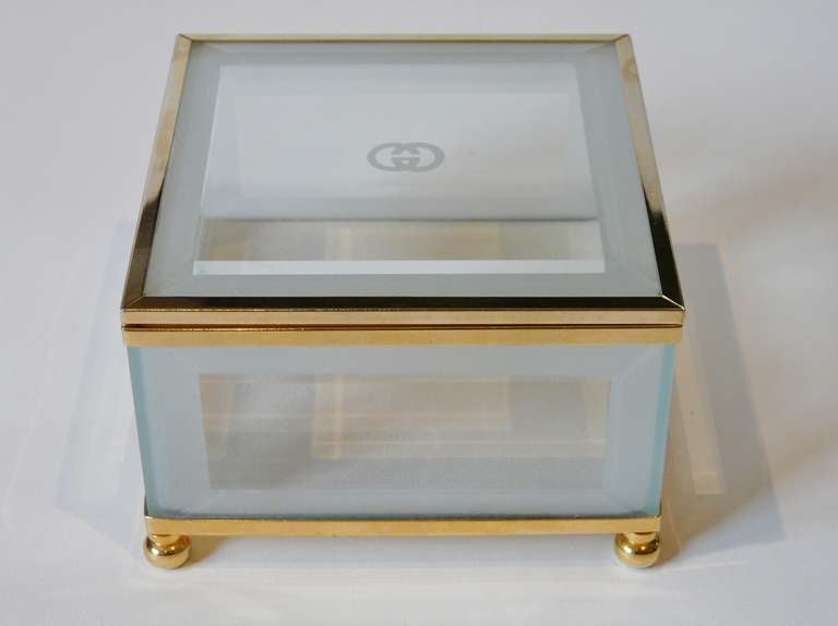 Vintage Gucci Glass and Brass Box having etched glass beveled panels and brass fittings rising on bun feet. 