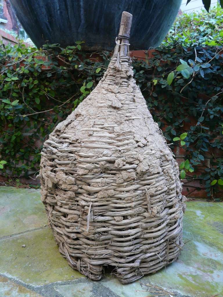 Fantastic antique bee skep ( like a bird house but for bees / beekeeping) from Provencal France,  hand woven of sapling and twigs and sealed with mud clay - an excellent decorator objet. These were made by hand throughout Europe for decades in the