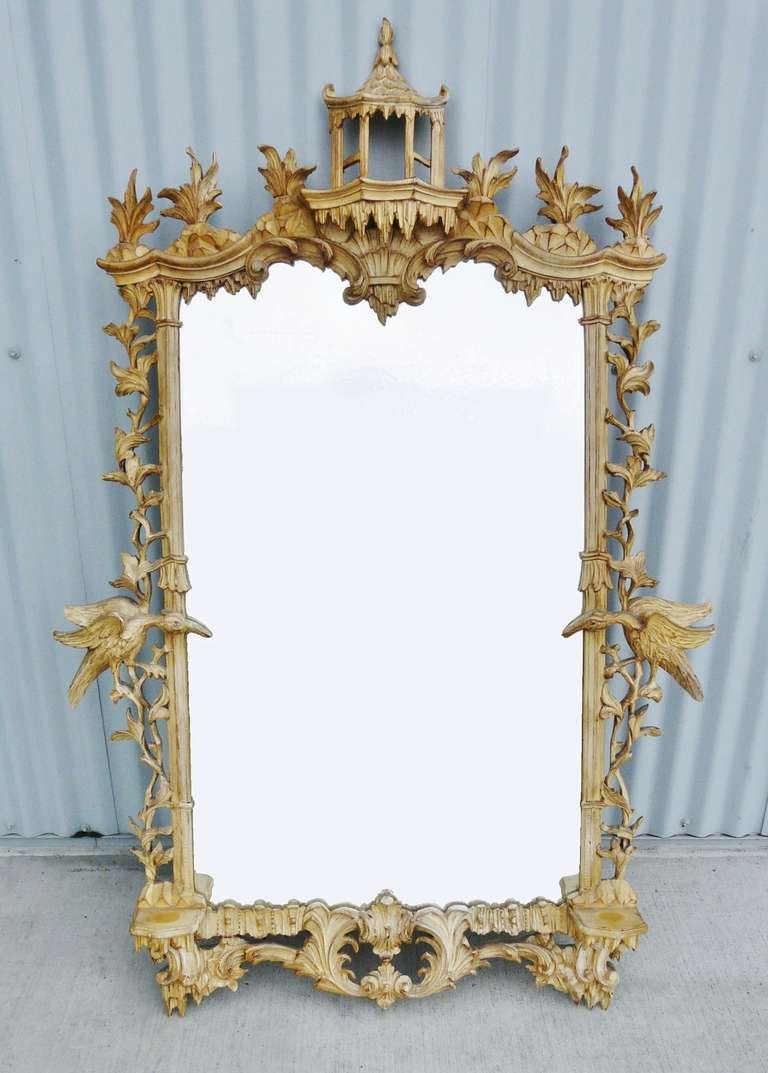 Exceptional large scale, vintage mirror having an elaborately hand carved wood frame in a bleached / limed finish,all carved in the Chinoiserie taste;  crested with a lovely pagoda cartouche and embellished with exotic birds and foliage, also having