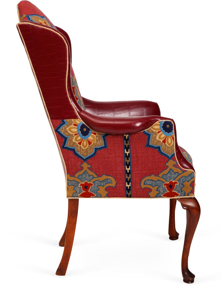 New collection Schumacher Temara embroidered print in pomegranate makes a bold statement on the inside front and seat of this vintage wing chair. Mix and match make this eclectic chair perfect for office, library or den.