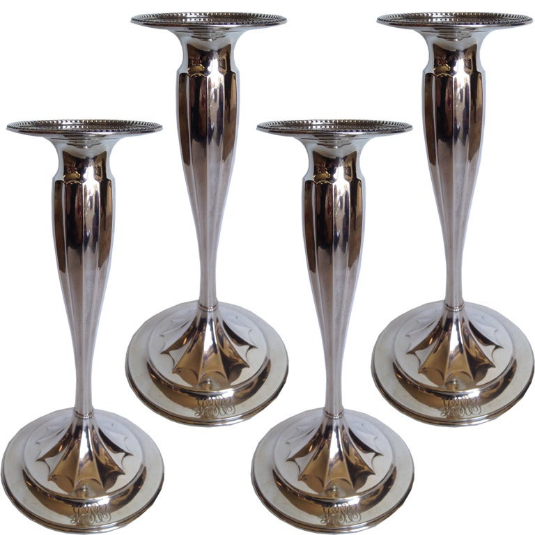 Beautifully shaped and fluted set of four candlesticks by Tiffany & Co. New York Possibly the finest maker of silver in the United States back when Tiffany was Actually making most of the silver they retailed. These are simply elegant
And will be