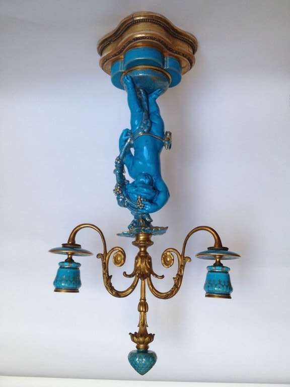 Offered are a wonderful model of putti form candelabra in the beautiful Celeste blue color. This color was made famous through orders by non other than Marie
Antoinette. The candelabra's finely cast gilt bronze arms held aloft by lovely the putti,