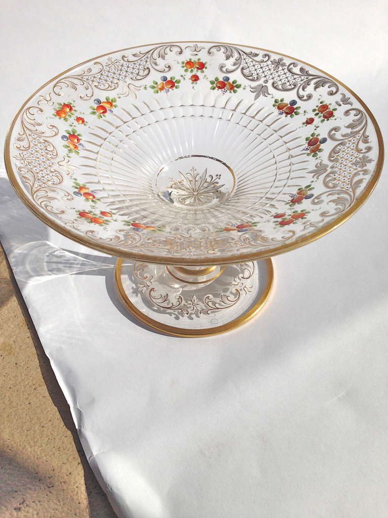 A lovely compote with enamel decoration and gilt highlights, some very nice cut work is also outstanding on this piece. The decoration of colorful fruit painting may be suggesting its purpose, You will find lots of ways to enjoy it
and it will