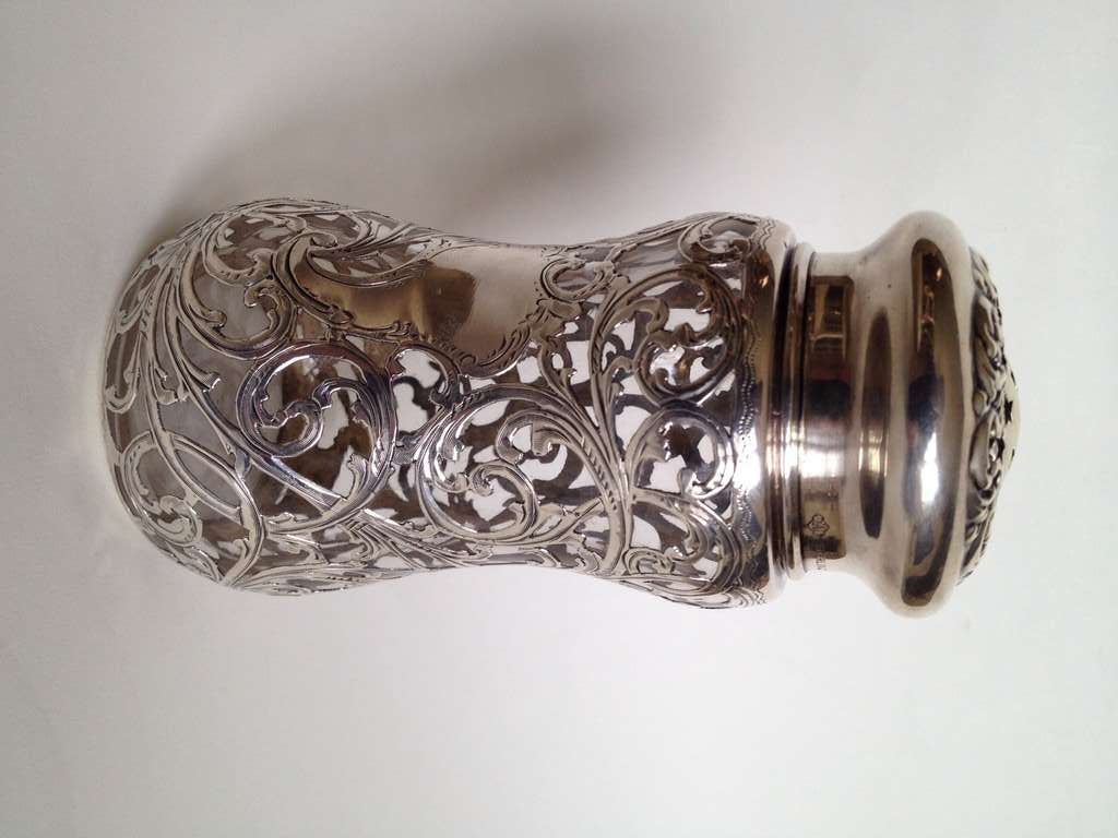 There is a lot of silver on this example and it is heavily laid on, the Art Nouveau pattern is lovely, the silver is signed Alvin which allows us to assume that Steuben is responsible for the glass. No monogram has been assigned to the
cartouche