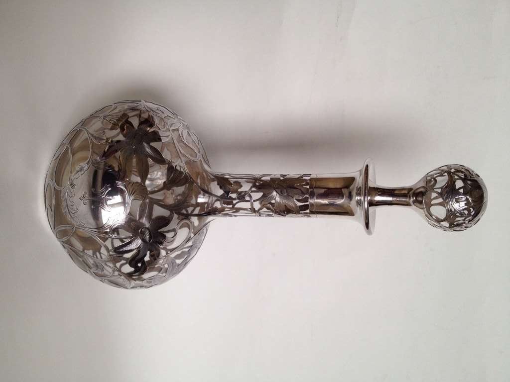 A very clean well preserved decanter, with super quality silver work involved, look at the photo of the stopper the flower is beautifully done and the over chasing is very fine and there is lots of it. The monogram is an advantageous 
One in that