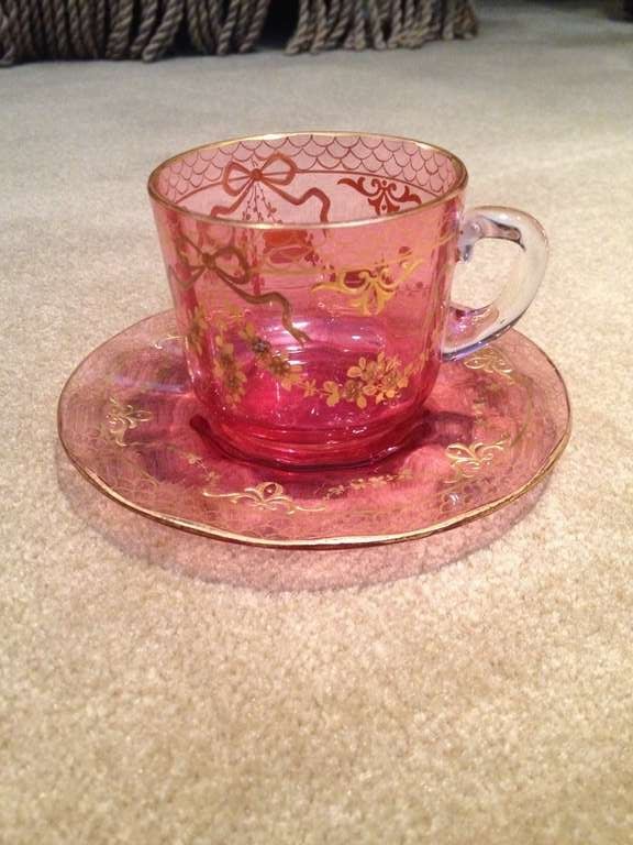 This single Moser cup and saucer is a beautiful example, the raised gold a swag of flowers is the perfect compliment to the cranberry color glass, just for you to enjoy your morning tea.